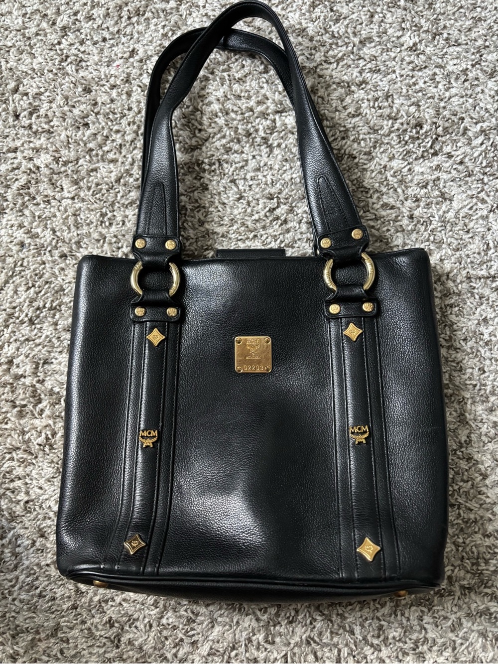 MCM Black Leather Shoulder Bag with Gold Plaque